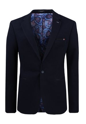 Dunkelblauer Blazer mit einem Knopf, gekerbtem Revers, paisleygemusterter blau-violetter Fütterung und einem kleinen Einstecktuch in der Brusttasche.