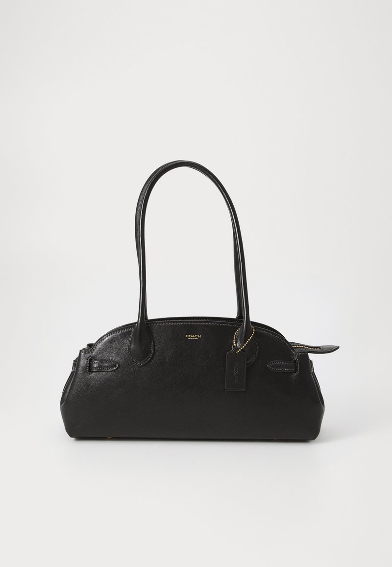 Schwarze Lederhandtasche mit runder Form, zwei langen Griffen, goldenen Beschlägen und einem kleinen Anhänger. Mit Reißverschluss oben.