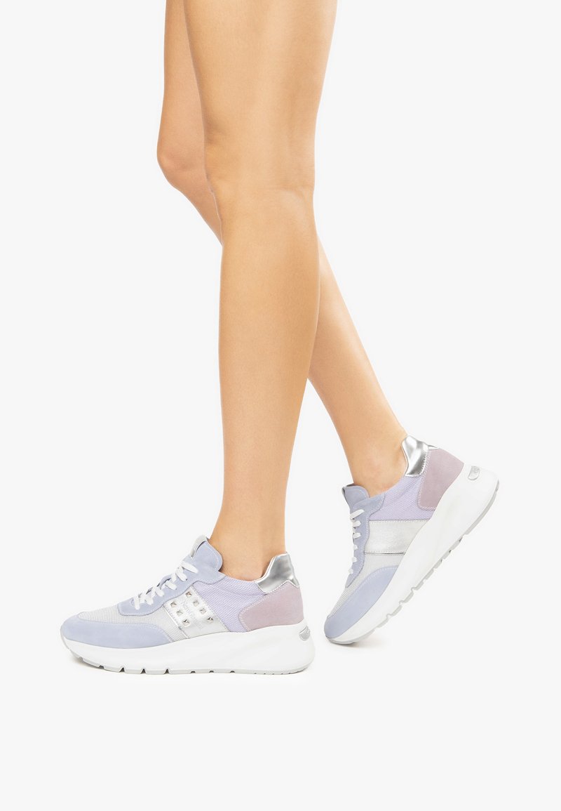 Purple and gray athletic sneakers with silver accents, featuring textured fabrics and a cushioned sole for support and comfort.