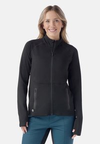 Giacca in pile nera con zip, caratterizzata da maniche lunghe, due tasche laterali con zip e un collo alto con cuciture raglan per una migliore libertà di movimento.