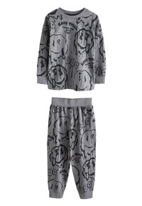 Ensemble de pyjama gris à manches longues avec taille élastique. Comprend un imprimé graphique noir de visages souriants et du texte. Tissu doux, coupe confortable.