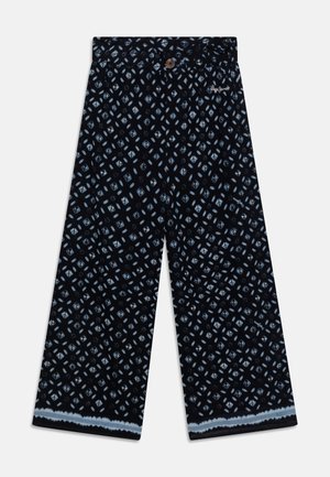 Pantalones de pierna ancha en tela azul marino con un patrón geométrico en azul claro. Detallados con un cierre de botón y un dobladillo recortado.