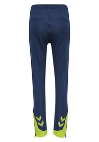 Marina atletiska byxor med en luftig textur, med limegröna detaljer och dragkedjedetaljer på nederbenen.