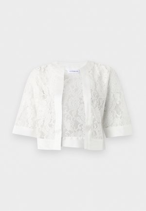 Cardigan court en dentelle blanche avec manches trois-quarts et bordure unie le long de l'encolure, de l'ouverture devant et des poignets.