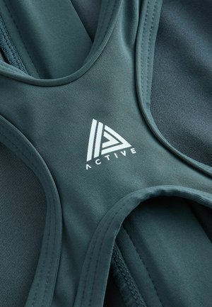 Next, Badpak - teal green