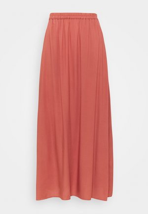 Coral-colored long skirt with elastic waistband and soft pleats, flowy fabric, and simple hem.