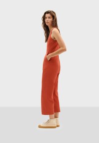Thinking Mu RAFFLESIA  - Kombinezon - red