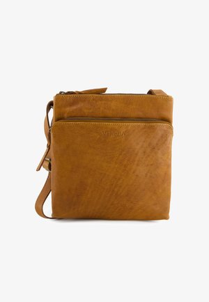 Tan leather crossbody bag with front zip pocket, embossed "VENEZIA" logo, and adjustable shoulder strap on white background.