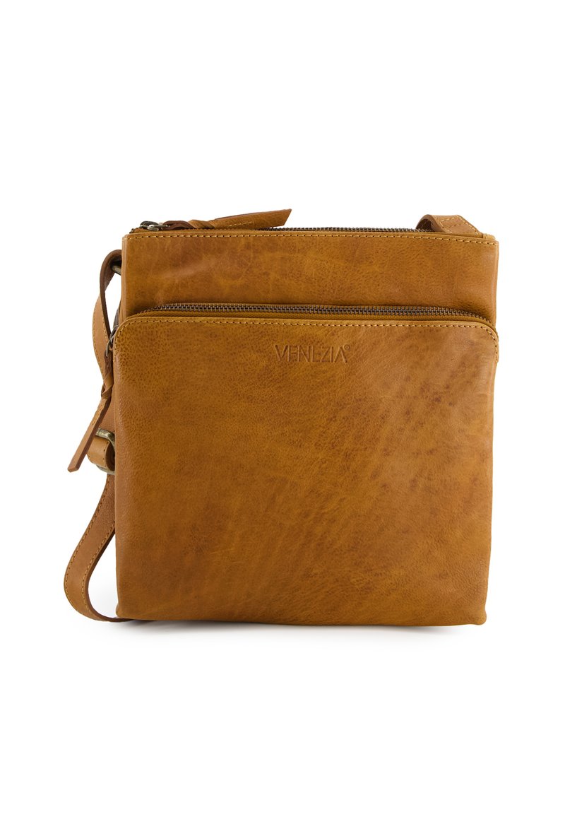 Tan leather crossbody bag with front zip pocket, embossed "VENEZIA" logo, and adjustable shoulder strap on white background.