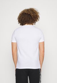 Lacoste Sport BIG LOGO - T-shirt desportiva - white/fireman