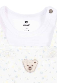 Body bianco per infante con motivi floreali, caratterizzato da un'applicazione testurizzata a forma di orso e chiusura a scatto. Materiale in morbido cotone; taglia 62.