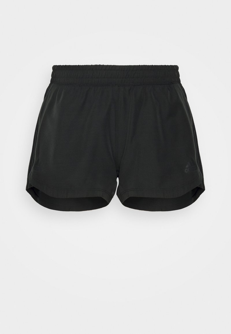 Shorts de sport noirs avec taille élastique et ourlets légèrement incurvés, conçus pour la course ou les activités sportives.