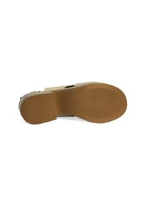 Beige high-heel shoe sole featuring a ridged texture and a tan rubber base. Includes a small, rounded heel for added stability.
