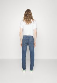 Redefined Rebel COPENHAGEN  - Traperice uskog kroja - medium blue
