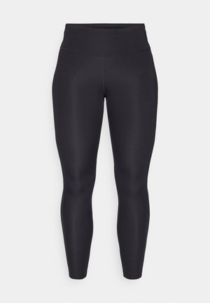 Fekete leggings magas derékkal, rugalmas anyagból készült. Simaszerkezetű és testhezálló kialakítás, látható varratok vagy minták nélkül.