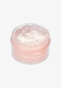 Maschera per la notte Abib PDRN collagen in un barattolo trasparente e rotondo. La consistenza gel è di colore rosa chiaro con bolle, etichettata con i dettagli del prodotto.