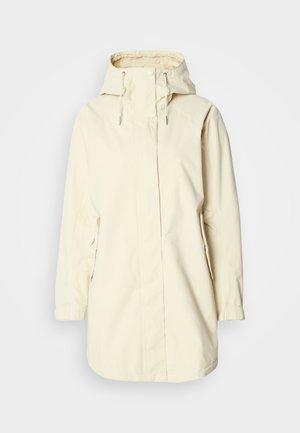 Kremine spalva atspari vandeniui striukė su gobtuvu, reguliuojamais raišteliais, ilgomis rankovėmis ir šoninėmis kišenėmis. Lygios tekstūros, paprasto dizaino.