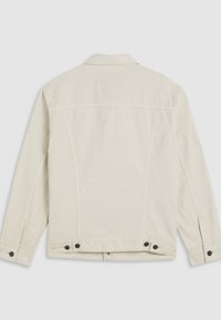 Vue de dos d'une veste beige unie avec manches longues, col et détails de boutons noirs aux poignets et à la taille.