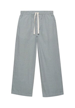 Pantalon gris à carreaux coupe ample avec taille élastique et cordon blanc, avec poches latérales et jambes larges.