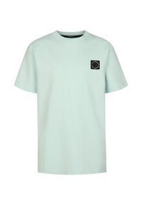 T-shirt di cotone verde menta con scollo rotondo e maniche corte. Presenta una toppa quadrata nera con testo bianco sulla parte sinistra del petto.