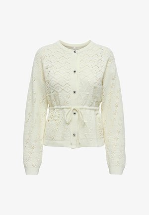 White knitted cardigan featuring a textured pattern, elastic waist with tie detail, and heart-shaped buttons along the front.