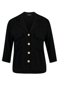 Blouse noire à manches trois-quarts avec col, quatre boutons beiges sur le devant et deux poches poitrine avec rabats.