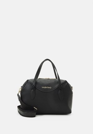 Black leather handbag with textured finish, dual handles, detachable strap, gold logo detail on front, and zip closure at top.