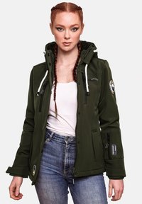 Green outerwear jacket with a hood, white drawstrings, zippered pockets, and logo patch. Worn over a white shirt and blue jeans.