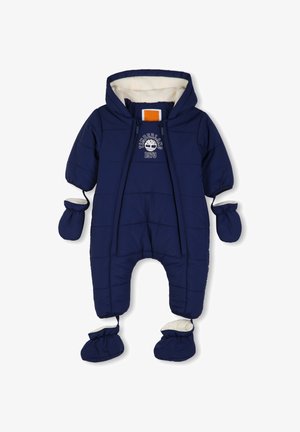 Combinaison de neige matelassée pour bébé bleu marine avec capuche, moufles et chaussons attachés, avec logo Timberland 1973 sur la poitrine.