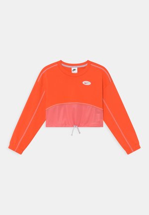 Lyse orange cropped sweatshirt med lange ærmer, pink mesh-panel, justerbar snor i kanten og lille Nike swoosh-logo på brystet.