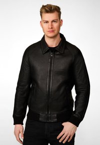 Black leather jacket with a zip front, ribbed cuffs, and a classic collar. Features smooth texture and side pockets.