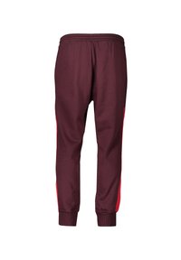 Wijnrode joggingsbroek met rode zijpanelen, elastische tailleband en geribbelde manchetten. Gemaakt van zachte stof met een ontspannen pasvorm voor comfort.
