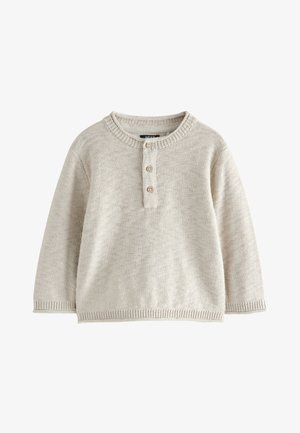 Světlý béžový pletený svetr s kulatým výstřihem, tříknoflíkovou légou a žebrovanými manžetami. Texturovaná látka s měkkým povrchem.