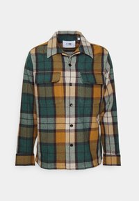 Košile s dlouhým rukávem na knoflíky s kostkovaným vzorem v zelené, hořčicově žluté, hnědé a krémové barvě a dvěma kapsami s klopami na hrudi.