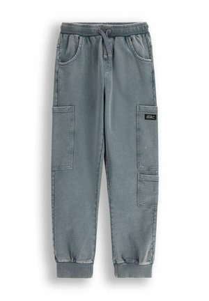 Jasnoniebieskie spodnie cargo z elastycznym paskiem i mankietami, z dwoma bocznymi kieszeniami oraz dwiema dużymi kieszeniami cargo. Wykonane z materiału przypominającego denim.