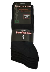 Schwarze Baumwollsocken in einer Packung mit gerippter Textur. Das Etikett zeigt ein medizinisches Symbol und besagt 100 % Baumwolle, hygienisch und frisch.