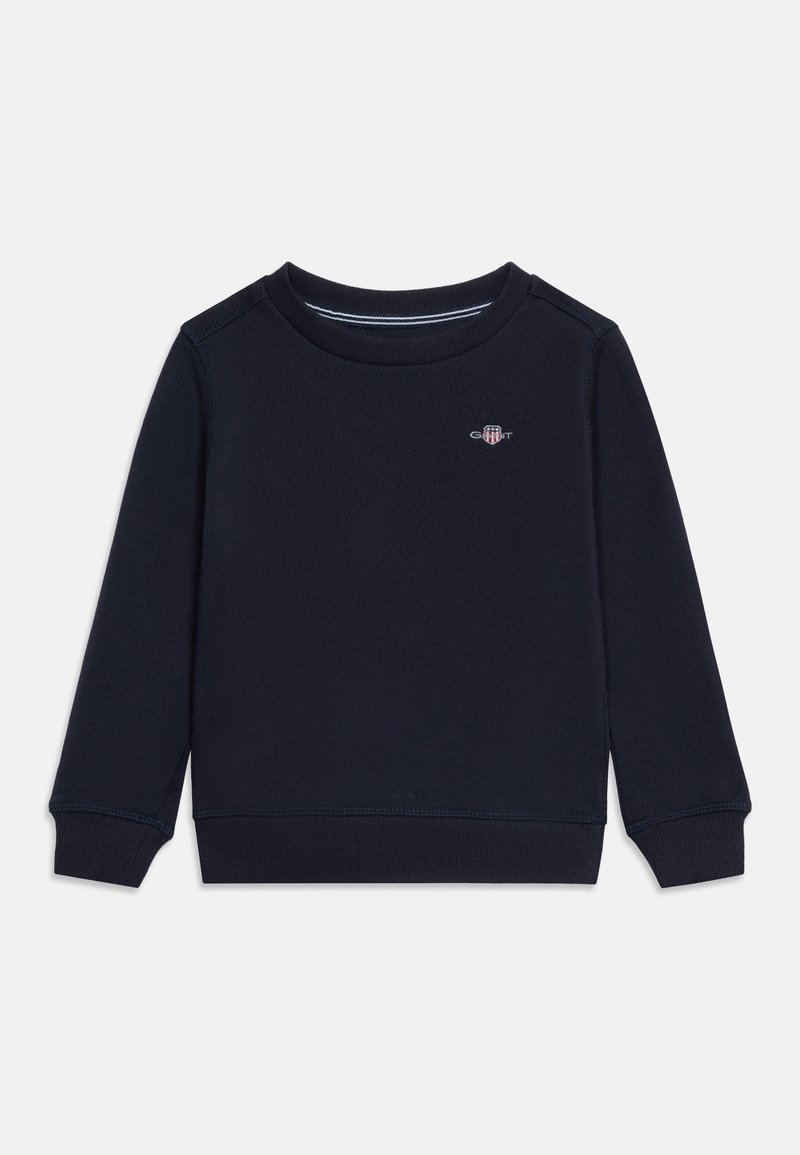 Μπλε ναυτικό φούτερ με λαιμόκοψη, μακριά μανίκια, ριπ μανσέτες και τελείωμα, και μικρό κεντημένο λογότυπο στο πάνω μέρος του στήθους.