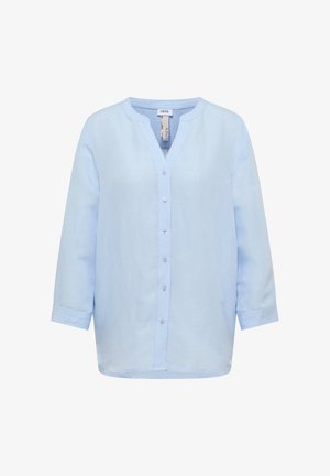 Blusa de lino azul claro de manga larga con cuello mao, cierre frontal con botones y corte holgado.