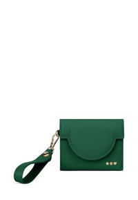 Green leather cardholder with gold hardware, rounded flap, wrist strap, and three small gold dots as accents. Textured finish.