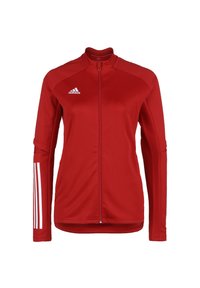 Rote Sportjacke mit durchgehendem Reißverschluss, langen Ärmeln, strukturierten Einsätzen und drei weißen Streifen an den Ärmeln. Adidas-Logo auf der linken Brust.