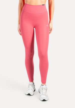 Strakke, hooggetailleerde legging in felroze, gemaakt van een glad, elastisch materiaal. Voorzien van een subtiel logodetail op de dij.