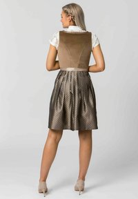 Brown velvet bodice with lace trim and a pleated metallic skirt featuring a subtle pattern. Includes a satin waistband and neutral heels.