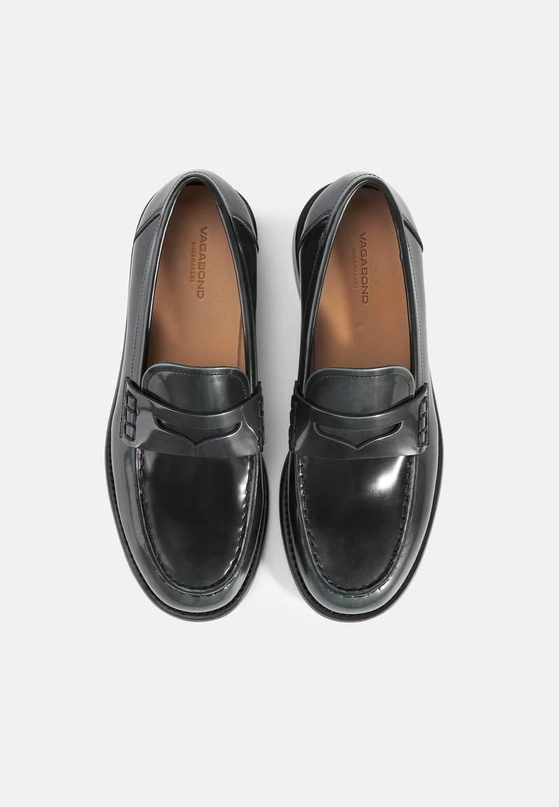 Schwarze Lederloafer mit glatter Oberfläche, ausgestattet mit einem dekorativen Riemen und genähten Details, runder Zehenpartie und einer gepolsterten Einlegesohle.