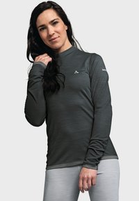 Langärmliges Sporttop in Dunkelgrau, aus strukturiertem Stoff. Mit einem figurbetonten Schnitt, Rundhalsausschnitt und dezentem Logo auf der Brust.