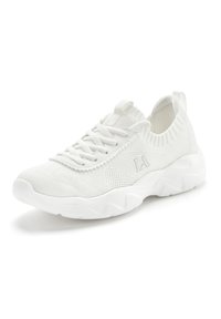 White athletic sneakers with a knitted upper, lace-up design, and textured sole featuring wavy accents. Lightweight and breathable material.