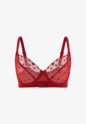 Reggiseno rosso trasparente con ricamo a forma di cuore, spalline regolabili, ferretto e un piccolo fiocco al centro davanti.