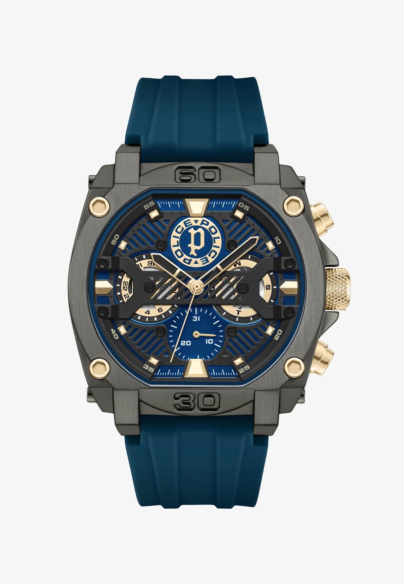 Melna un zila pulksteņa ar masīvu dizainu, ar gumijas siksnu, zelta akcentiem un vairākiem subdizainiem hronogrāfa funkcijai.
