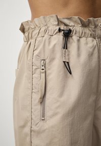 Ellos Collection WINDSCHUTZ - Bukser - beige