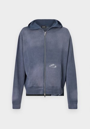 Zip-up hoodie in gradient dark blue, featuring a front pocket and embroidered detail. Cotton material with a soft, slightly textured finish.