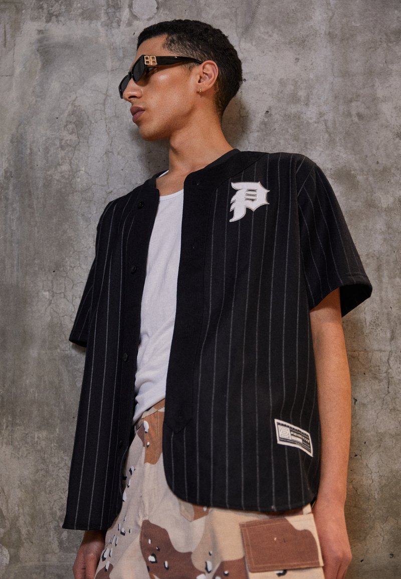 Primitive LEGEND BASEBALL Shirt black Zalando.ie